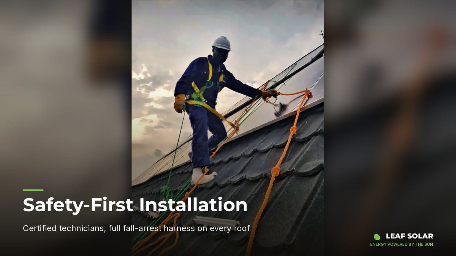 Leaf Solar technician wearing a safety harness during a rooftop installation